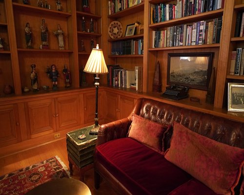 Cozy reading corner with warm ambient lighting and soft textures